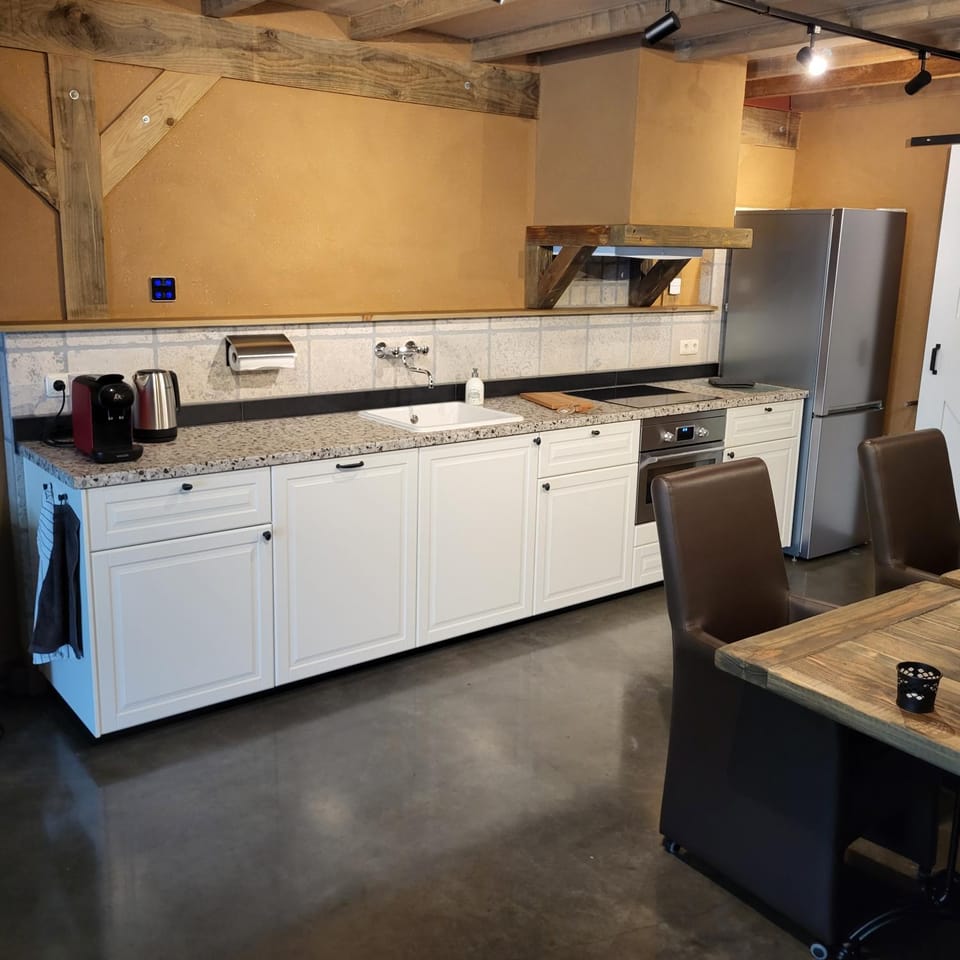 Kitchen or kitchenette, dishwasher, oven, stove