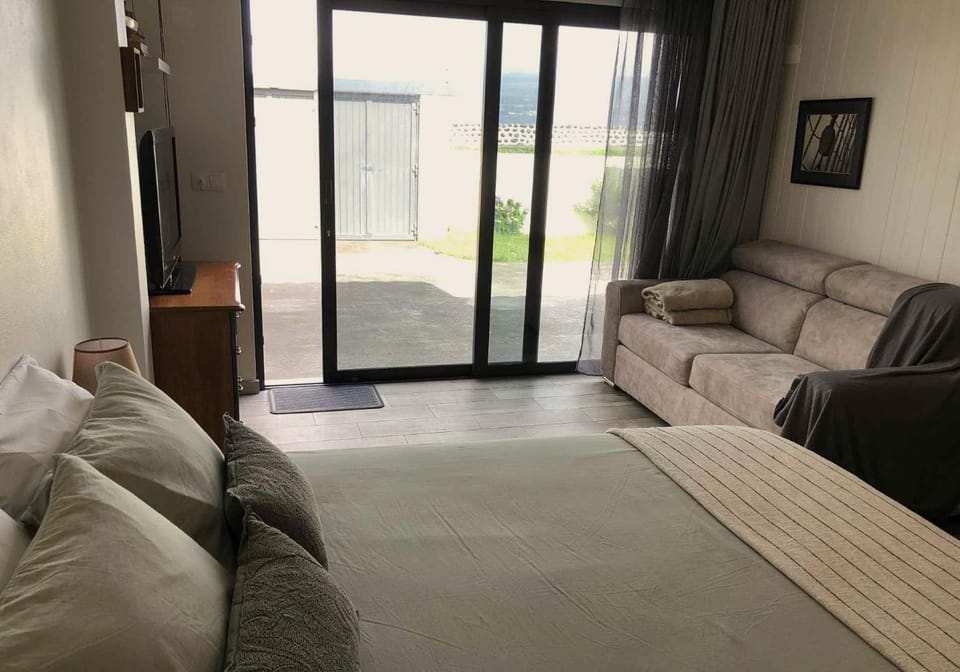 Bed, Living room, Seating area, Bedroom