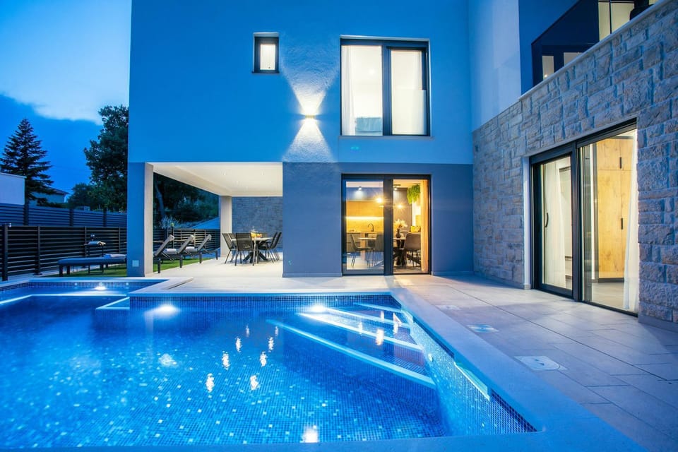 Property building, Patio, Night, Pool view, Swimming pool