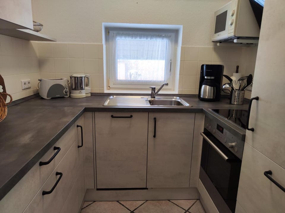 Kitchen or kitchenette, oven, stove