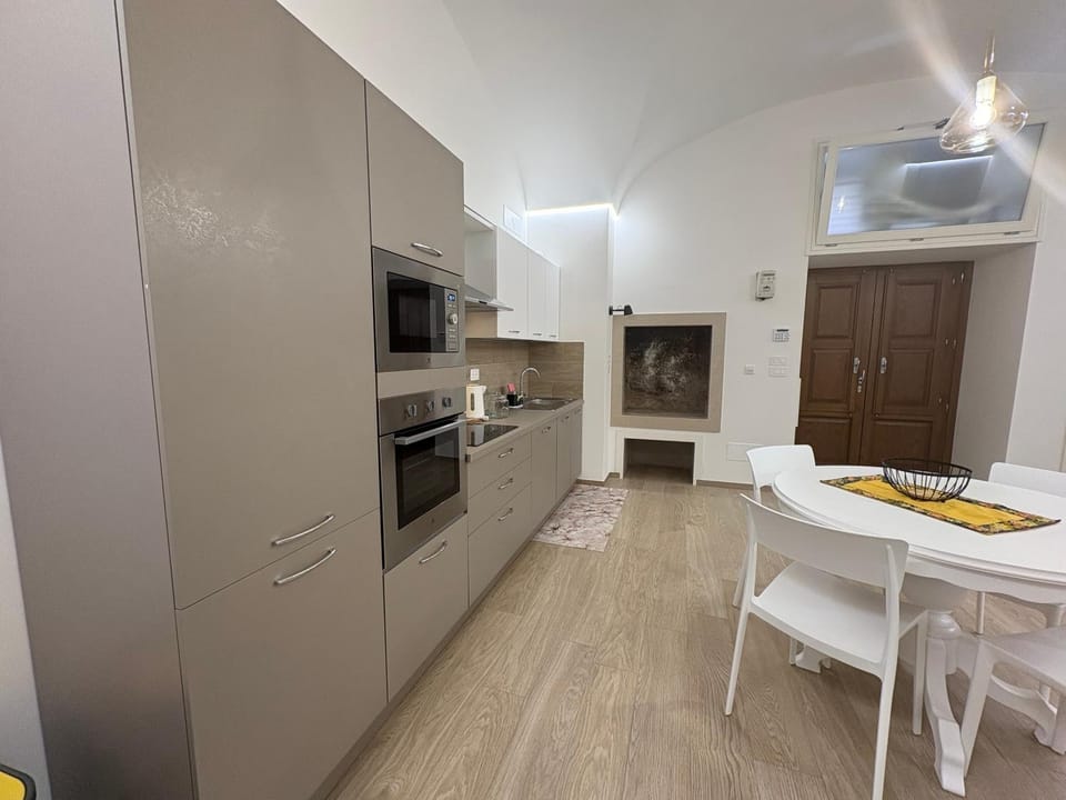 Kitchen or kitchenette, dishwasher, oven, stove