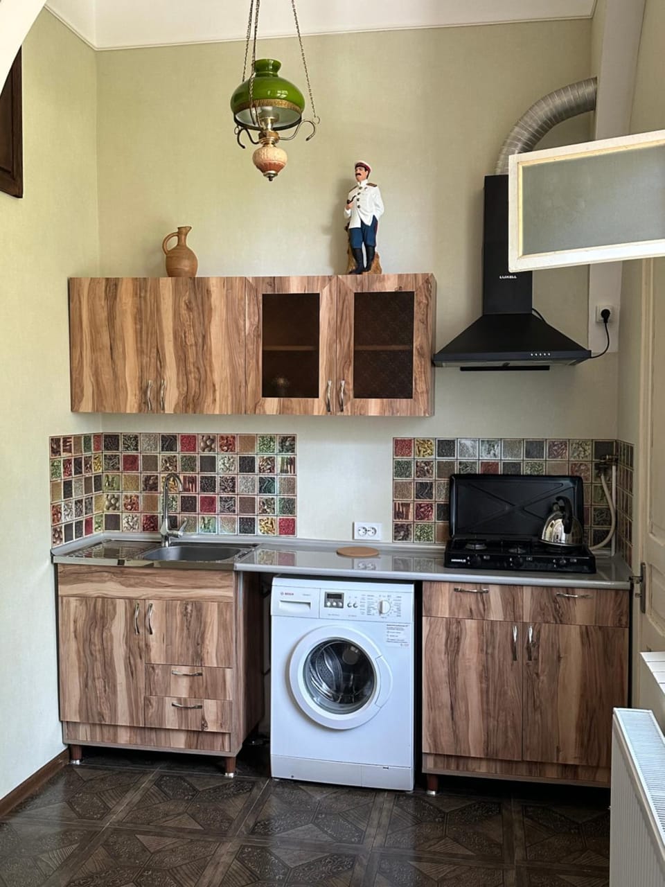 Kitchen or kitchenette, stove, washing machine