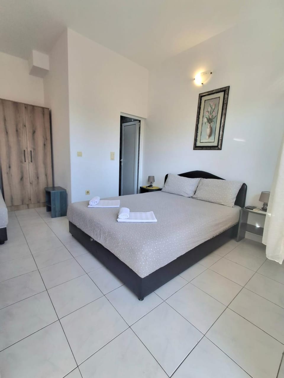 Bed, towels, wardrobe