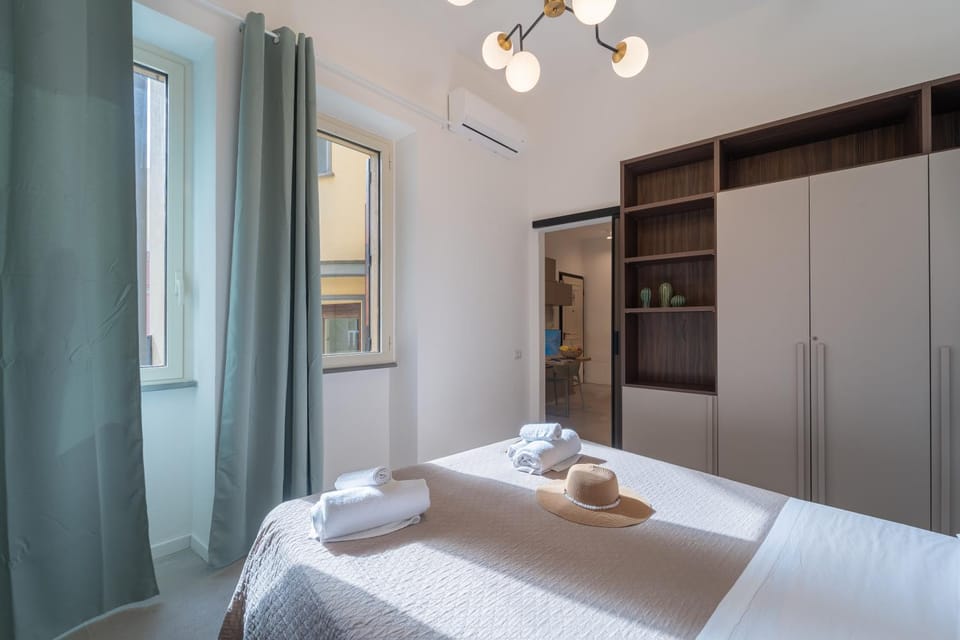 Shower, Bed, Photo of the whole room, Bedroom, hair dryier, towels, wardrobe, dryer, kitchen, air conditioner