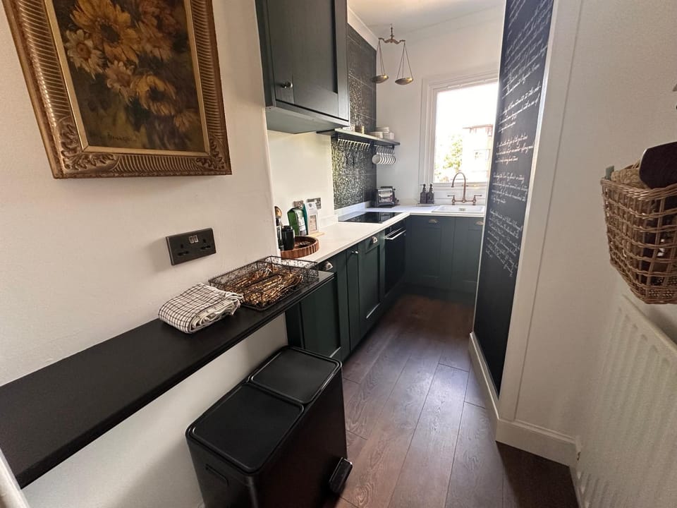 Kitchen or kitchenette, dishwasher, oven, stove