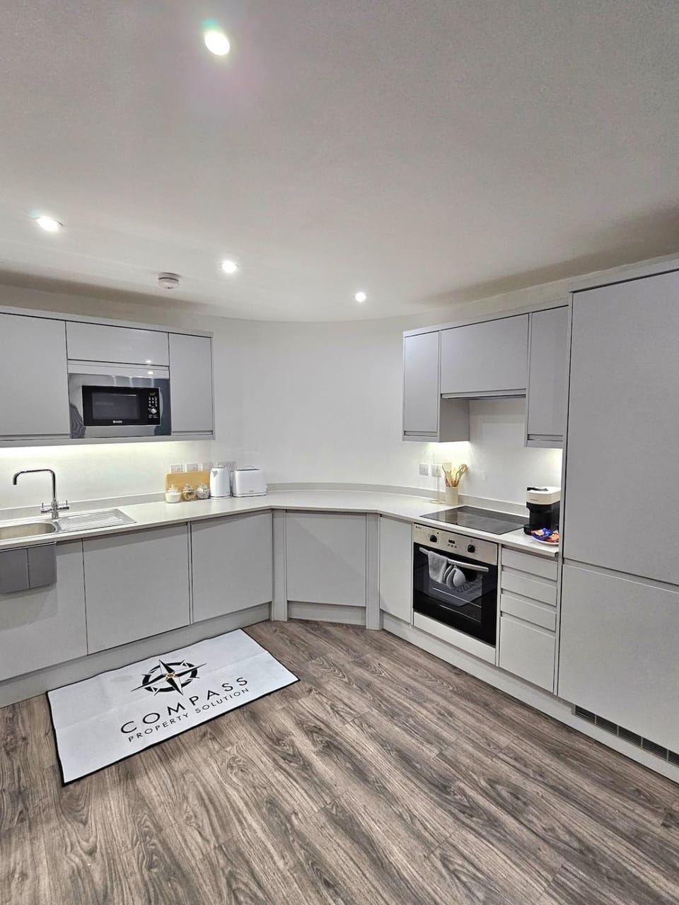 Kitchen or kitchenette, dishwasher, oven, stove, toaster
