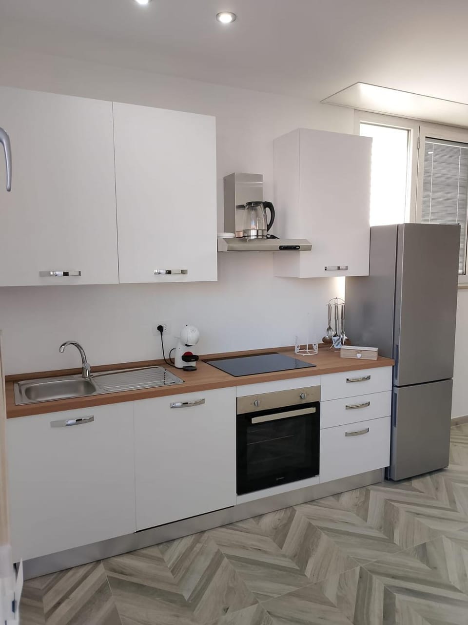 Kitchen or kitchenette, dishwasher, oven, stove