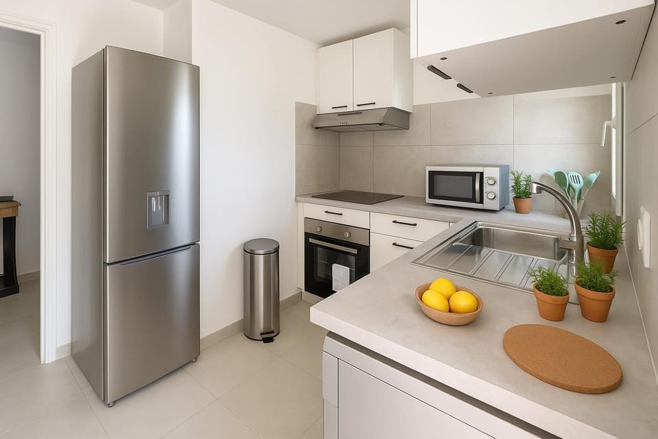 Kitchen or kitchenette, dishwasher, oven, stove