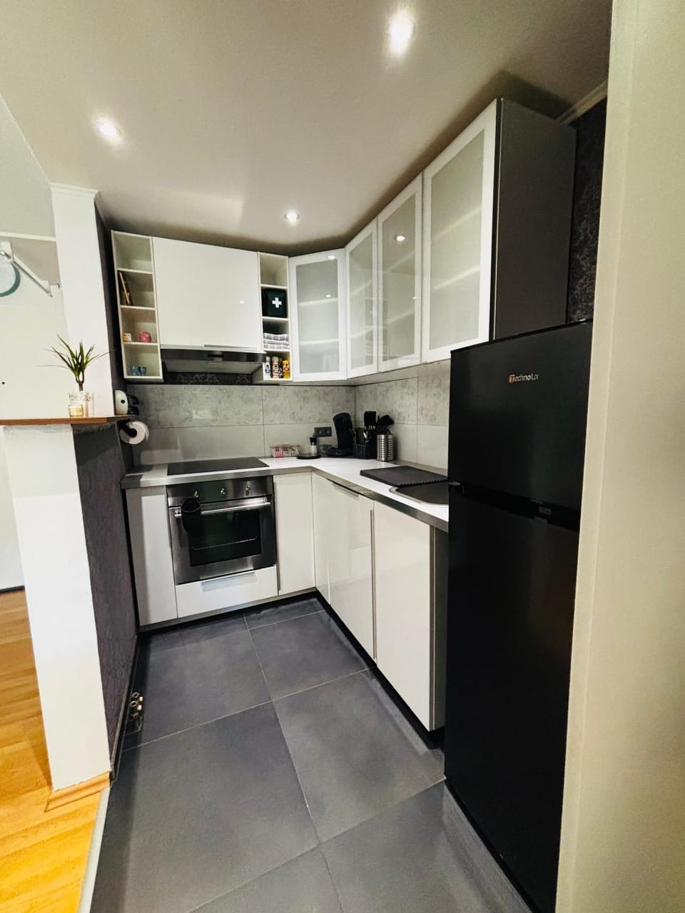 Kitchen or kitchenette, dishwasher, oven, stove, toaster