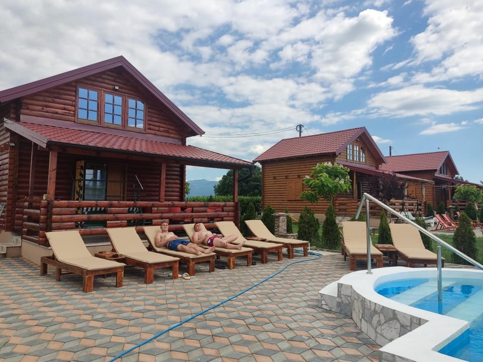 Property building, Patio, Pool view, Swimming pool, sunbed