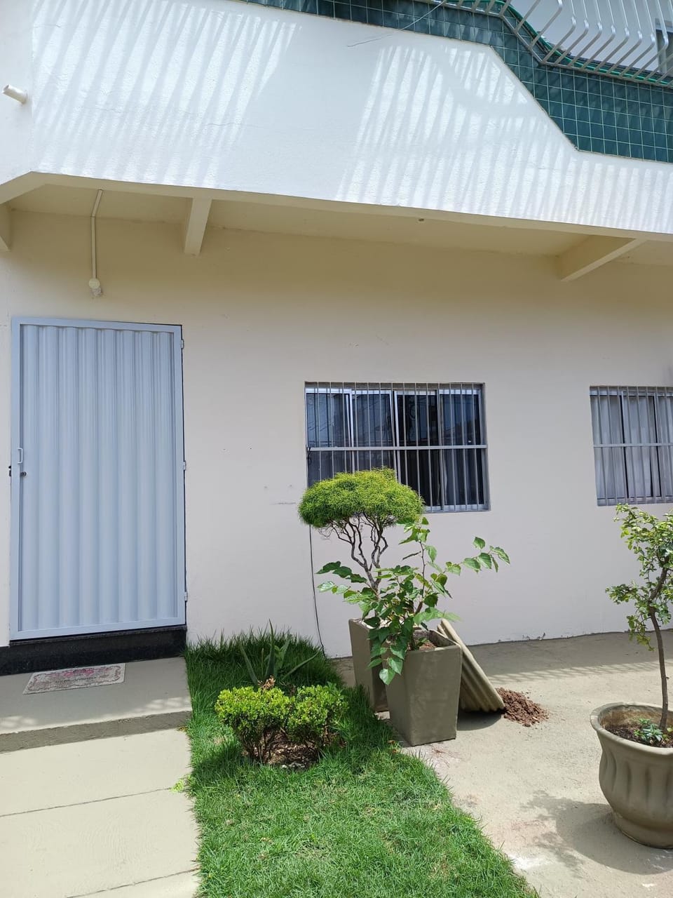 Suíte bem localizada, perto da praia, ar-condicionado e garagem Vacation rental in Serra