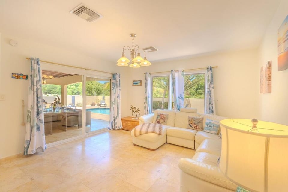Patio, Living room, Seating area, Pool view, Swimming pool
