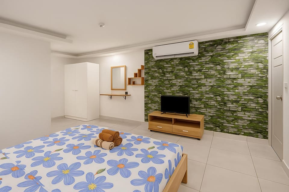 Communal lounge/ TV room, Bed, TV and multimedia, Living room, Other, Photo of the whole room, Decorative detail, Evening entertainment, Bedroom, Text overlay, Area and facilities, young children, Family, furniture, internet, storage, towels, wardrobe, air conditioner