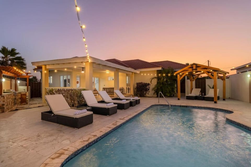 Property building, Swimming pool, Sunset, sunbed