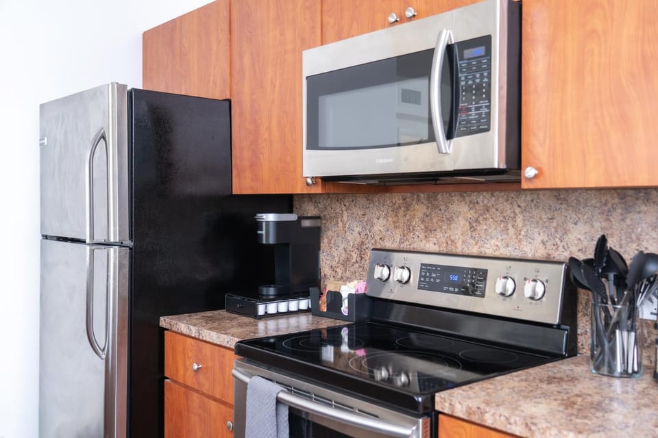 Kitchen or kitchenette, dishwasher, oven, stove, toaster