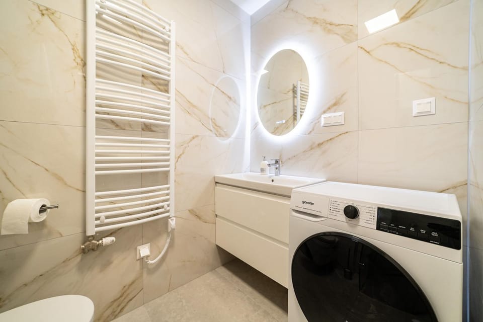 Shower, Toilet, Bathroom, towels, washing machine, dryer