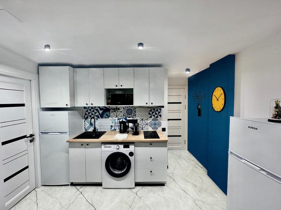 Kitchen or kitchenette, stove, washing machine, kitchen