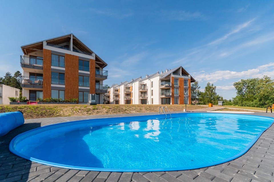Property building, Day, Pool view, Swimming pool, Swimming pool, sunbed