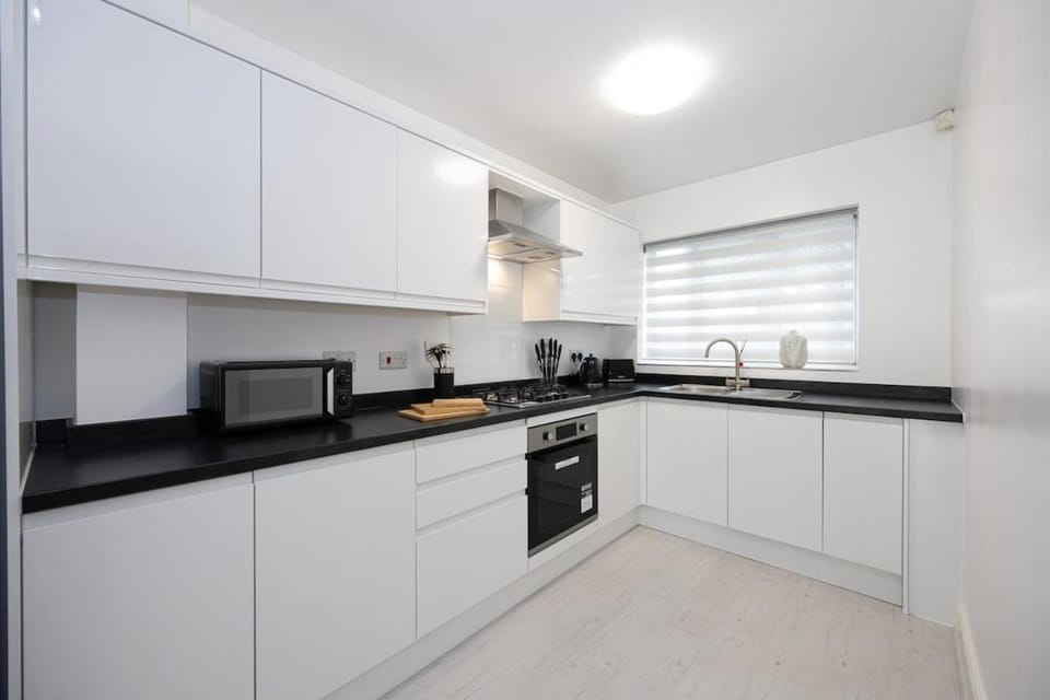 Kitchen or kitchenette, dishwasher, stove, toaster