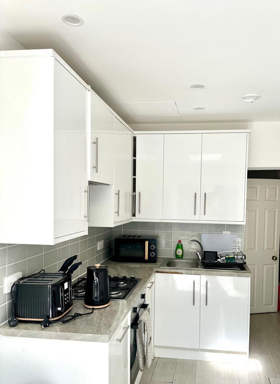 Kitchen or kitchenette, dishwasher, stove, toaster