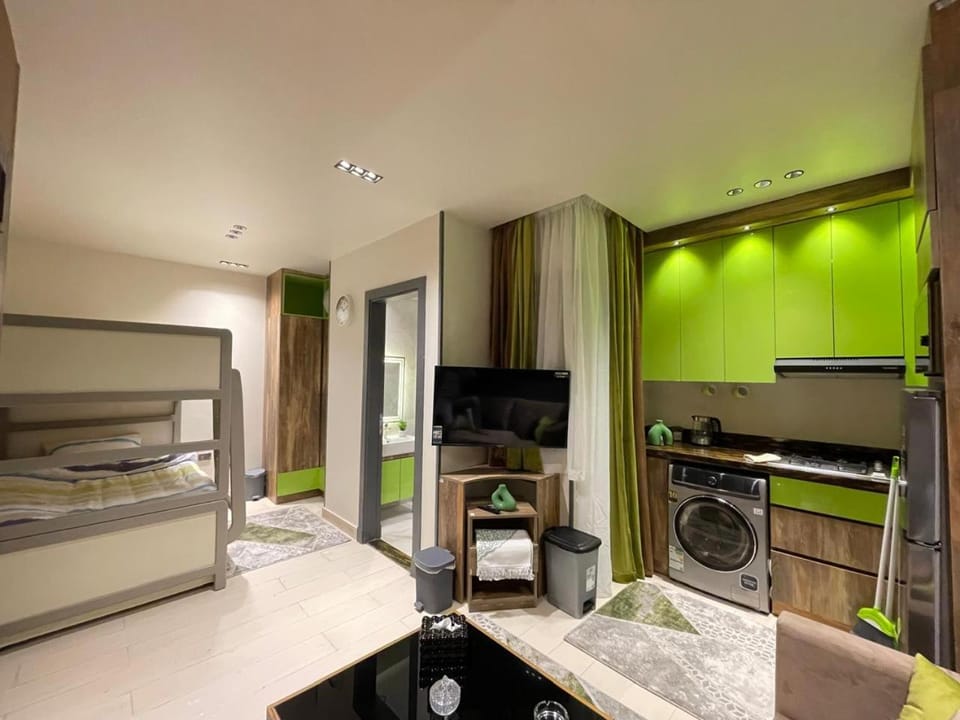 Kitchen or kitchenette, Photo of the whole room, bunk bed, microwave, oven, wardrobe, washing machine, air conditioner