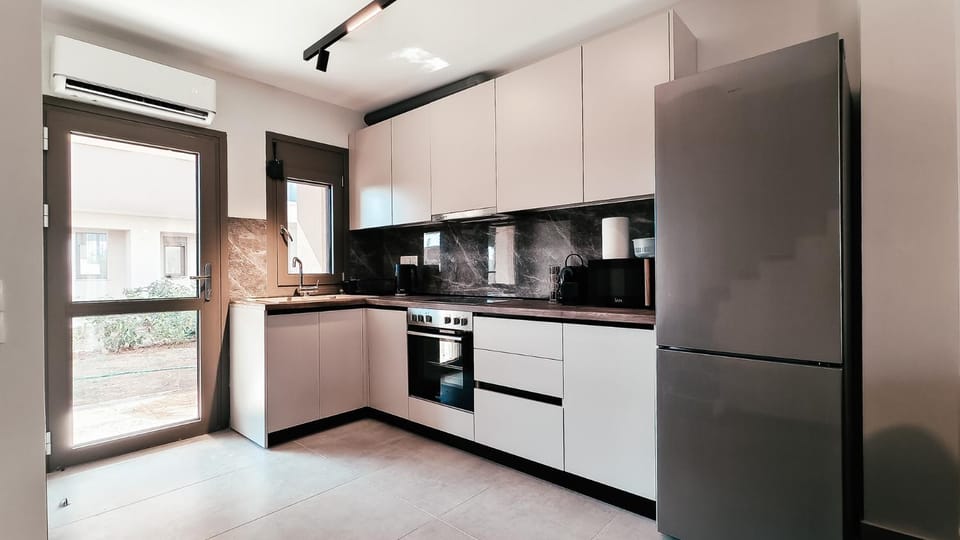 Kitchen or kitchenette, dishwasher, oven, stove