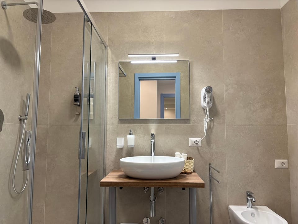 Shower, Toilet, Bathroom, Text overlay, bidet, hair dryier, towels