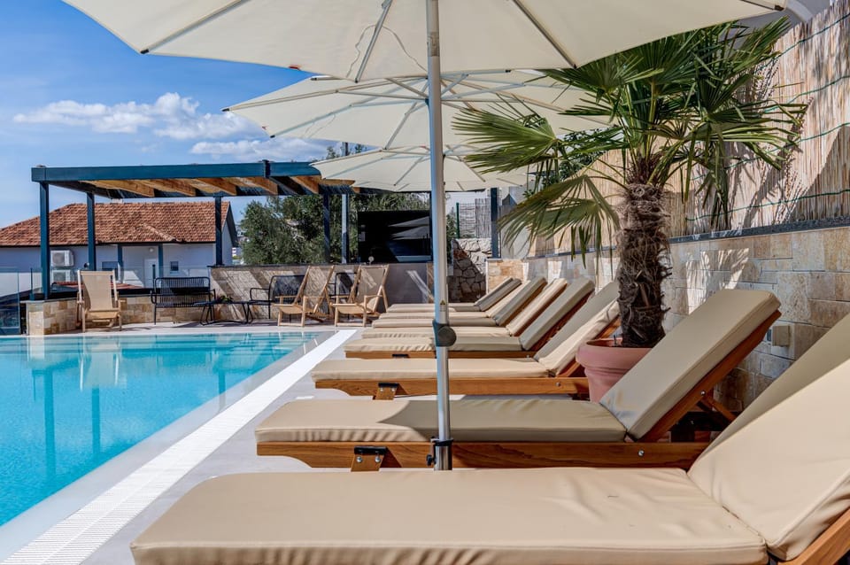 Patio, Day, Seating area, Pool view, Swimming pool, sunbed