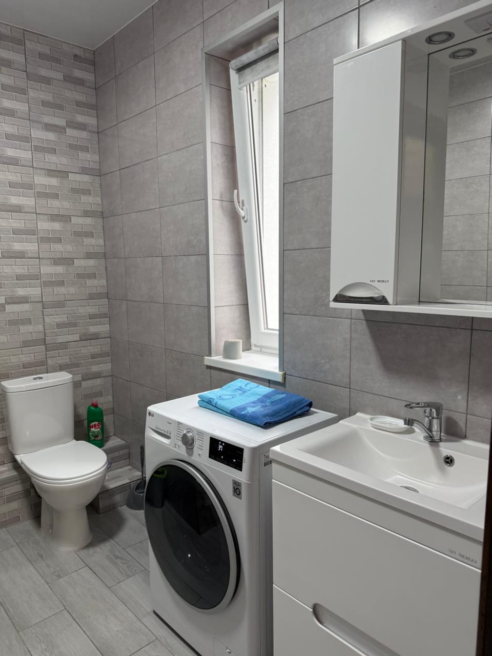 Toilet, towels, washing machine, dryer