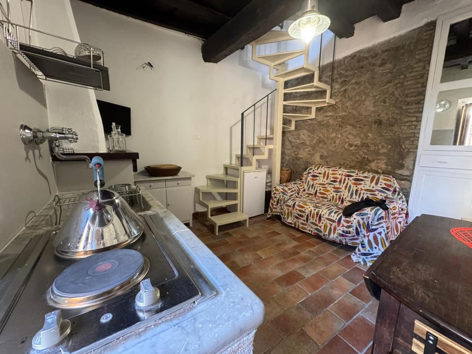 Property building, Kitchen or kitchenette, Living room, Seating area, fireplace, fireplace, stove, washing machine, washing machine