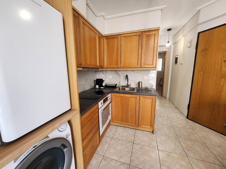 Kitchen or kitchenette, oven, stove, washing machine