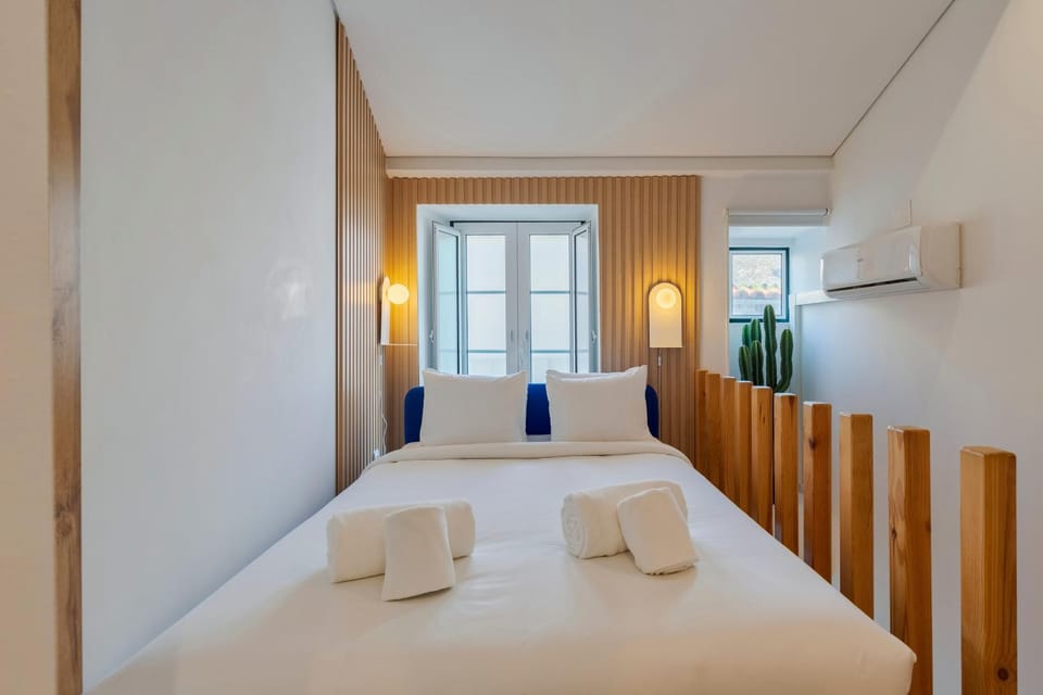 Bed, Photo of the whole room, Bedroom, towels, air conditioner