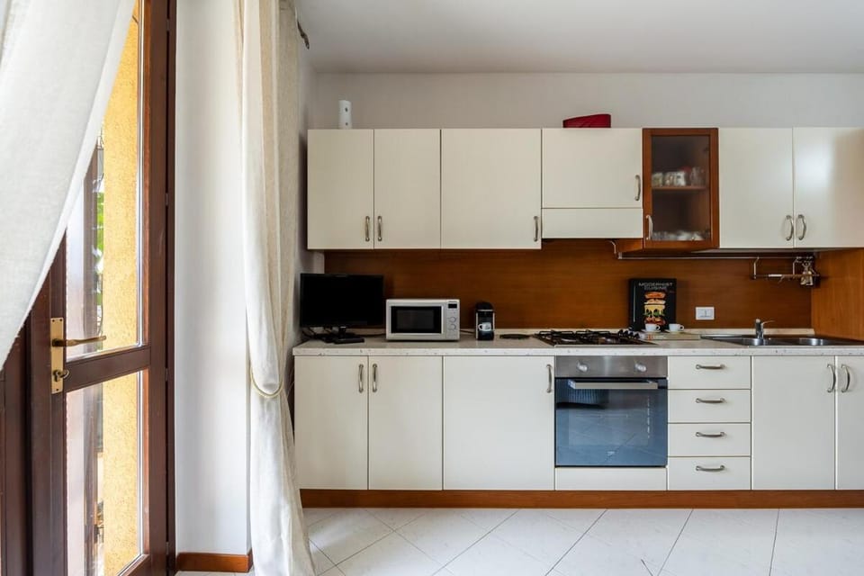 Kitchen or kitchenette, dishwasher, stove, toaster