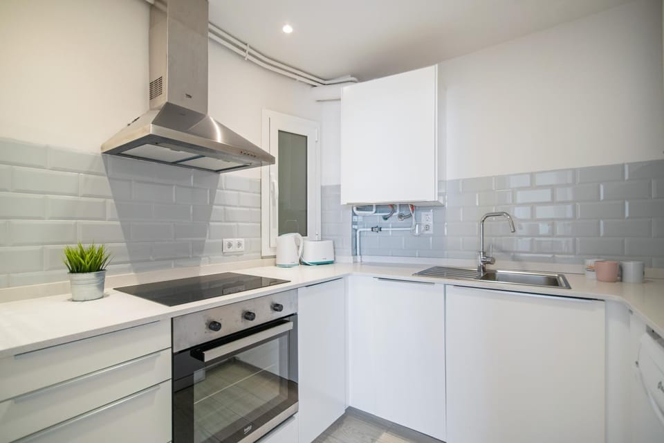 Kitchen or kitchenette, dishwasher, oven, stove