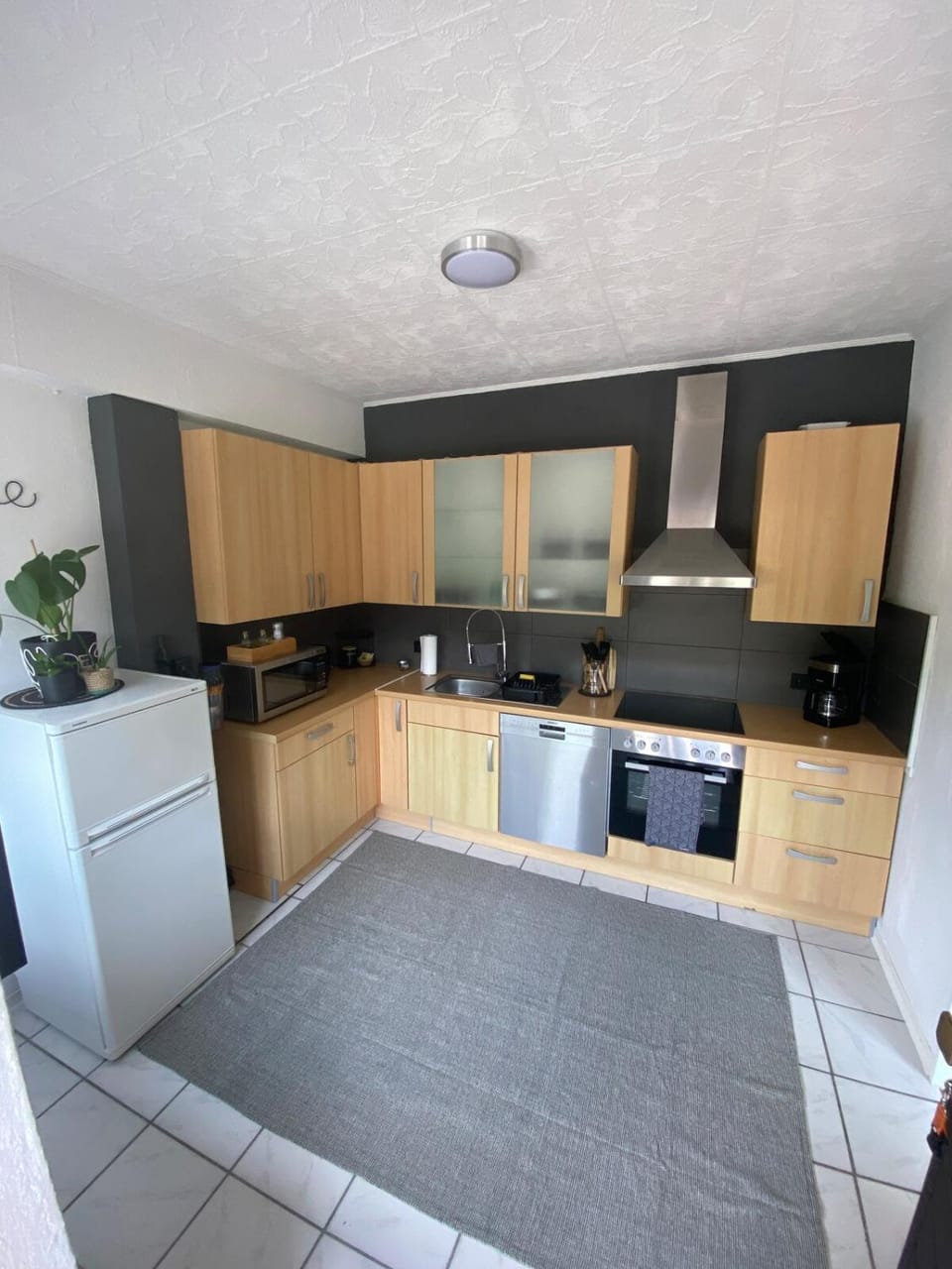 Kitchen or kitchenette, dishwasher, oven, stove, toaster