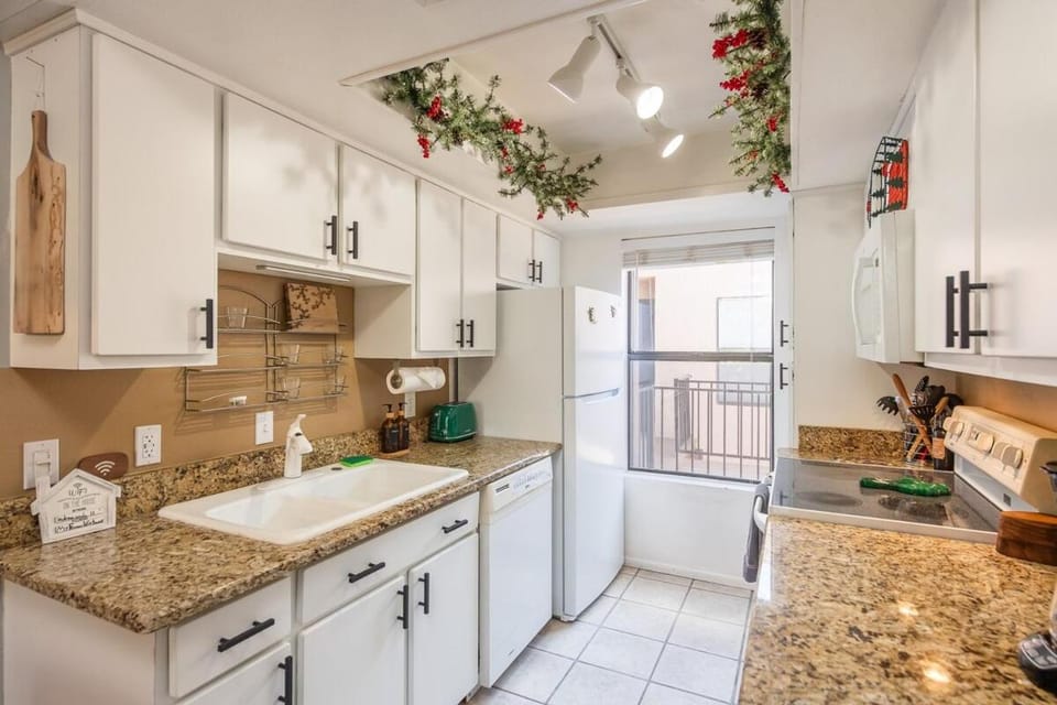Kitchen or kitchenette, dishwasher, oven, stove
