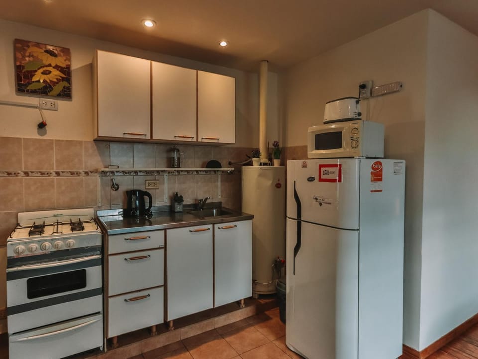 Kitchen or kitchenette, microwave, stove, toaster