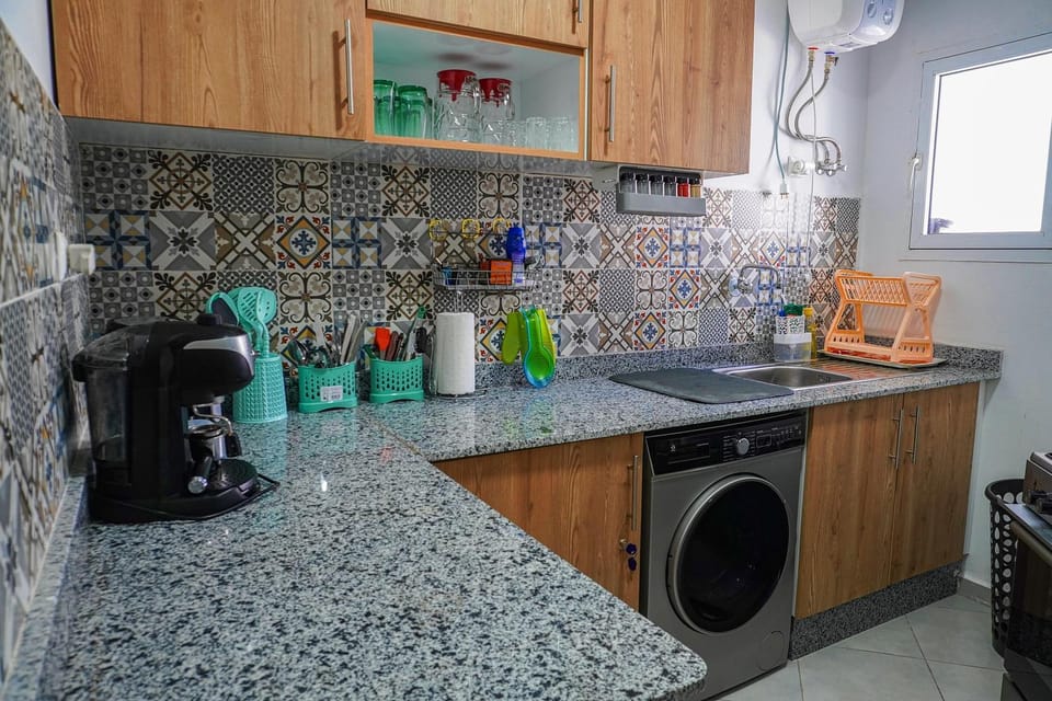 Kitchen or kitchenette, stove, washing machine