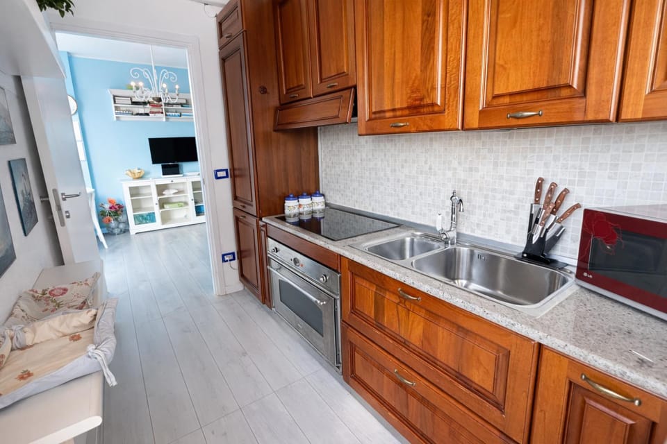 Kitchen or kitchenette, dishwasher, oven, stove