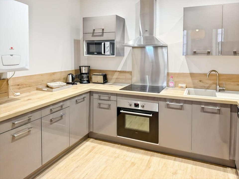 Kitchen or kitchenette, dishwasher, oven, stove, toaster