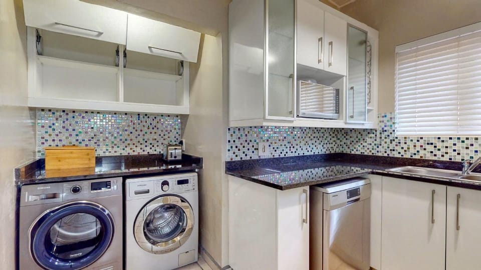 Kitchen or kitchenette, dishwasher, washing machine, dryer