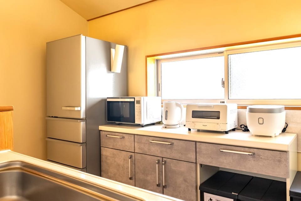 Kitchen or kitchenette, dishwasher, oven, stove, toaster