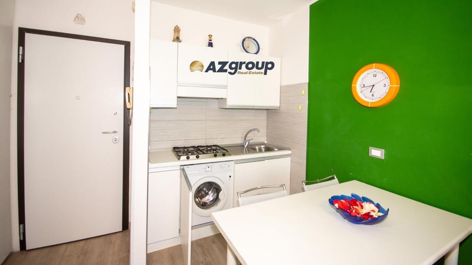 Kitchen or kitchenette, stove, washing machine