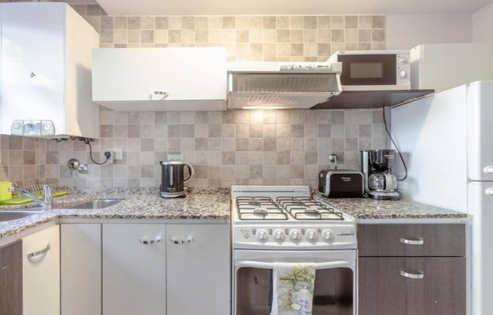 Kitchen or kitchenette, oven, toaster