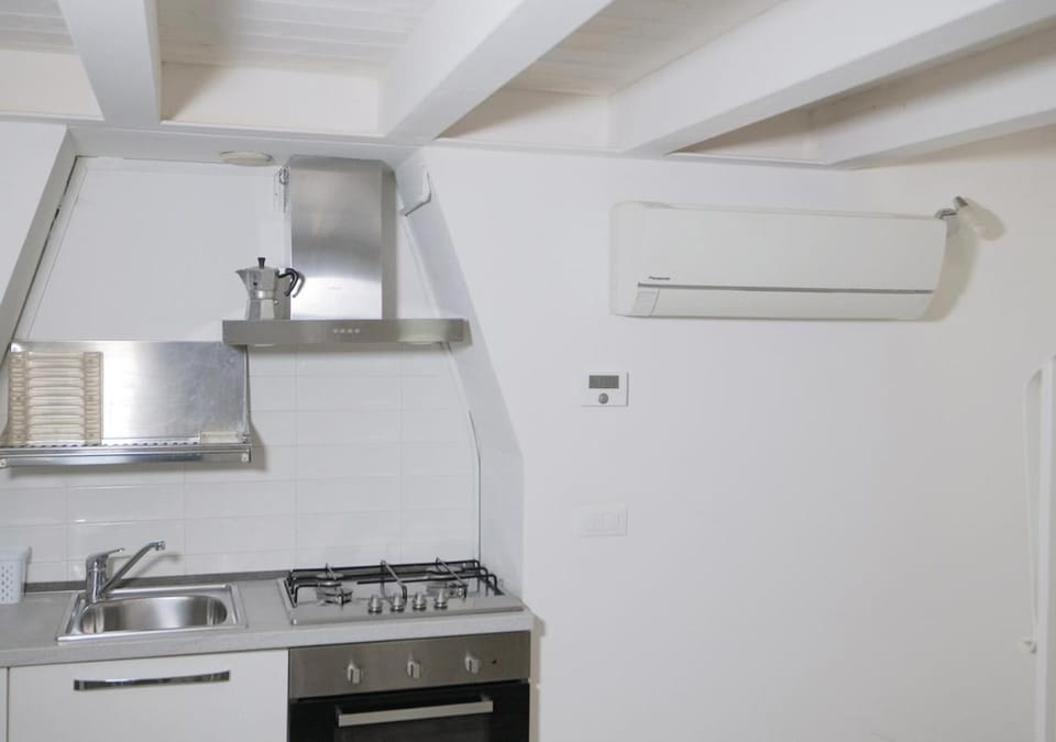 Kitchen or kitchenette, stove, kitchen, air conditioner