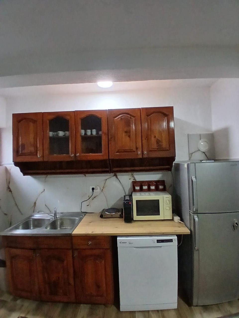 Kitchen or kitchenette, dishwasher, oven, stove