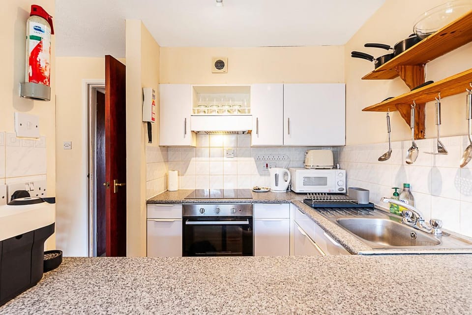 Kitchen or kitchenette, oven, stove