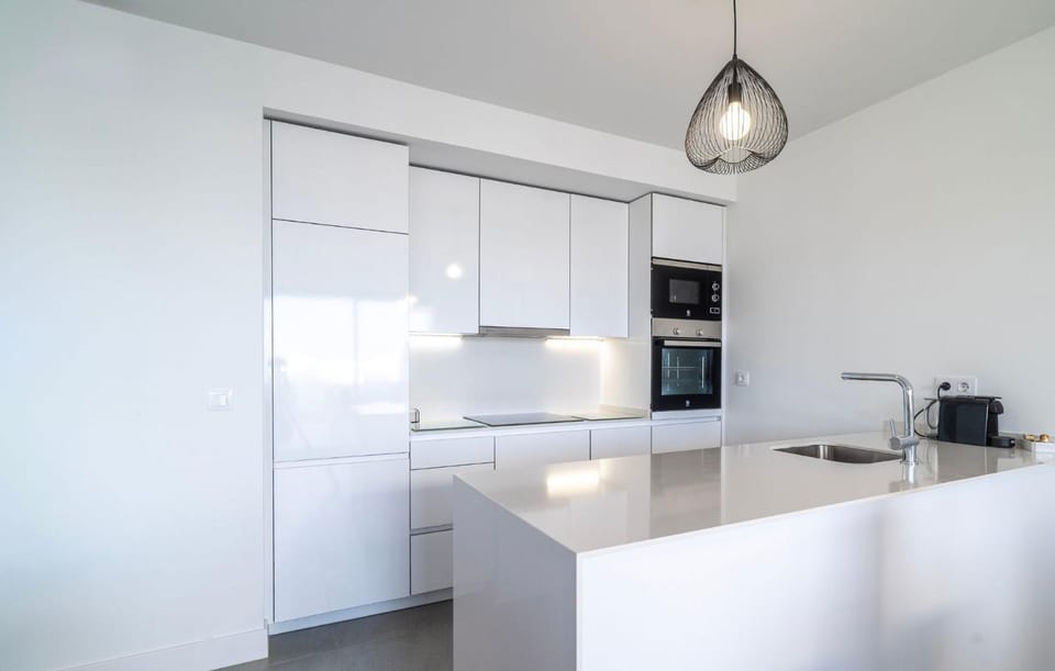 Kitchen or kitchenette, dishwasher, oven, stove, toaster
