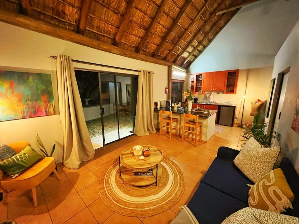 Kitchen or kitchenette, Living room, Seating area, Dining area, Garden view