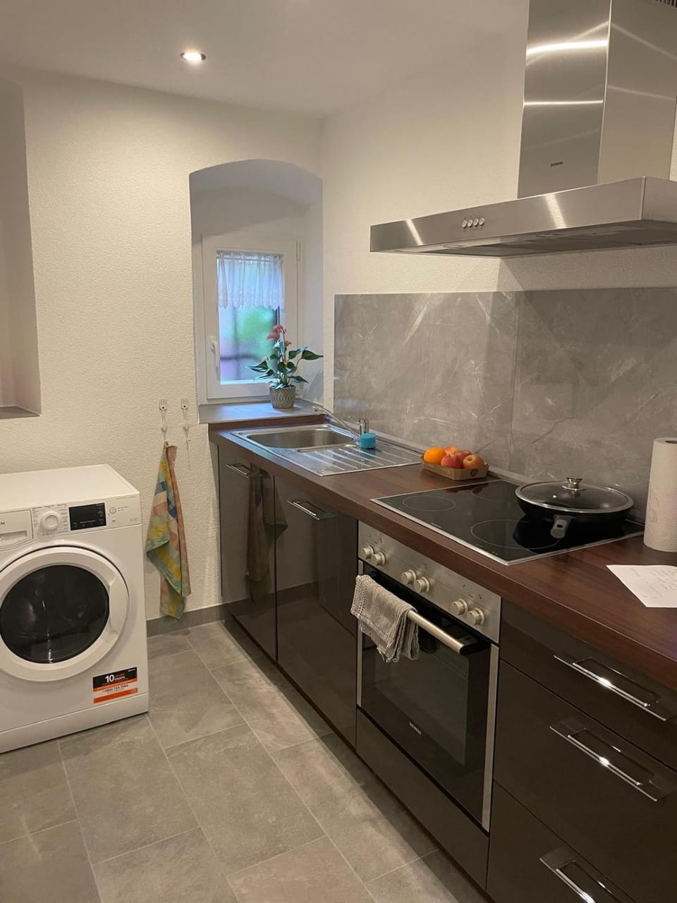 Kitchen or kitchenette, dishwasher, oven, stove, washing machine